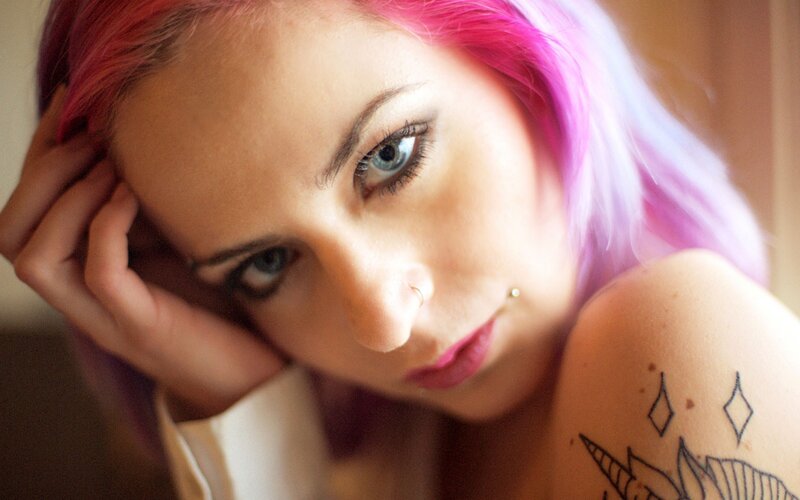woman with pink hair and tattoos