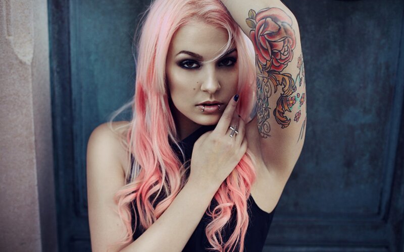 woman with pink hair and tattoos