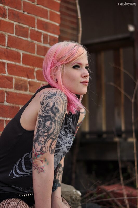 woman with pink hair and tattoos