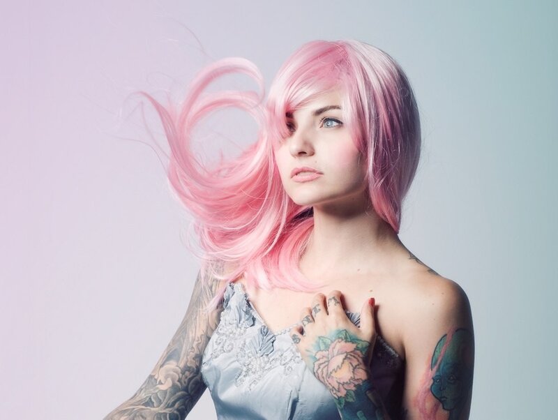 Woman with pink hair and tattoos