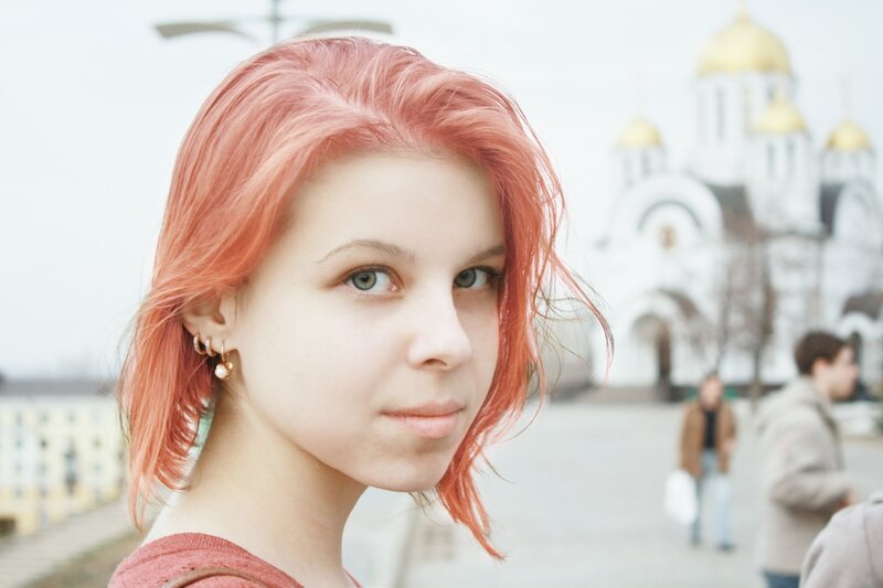 woman with pink hair in city
