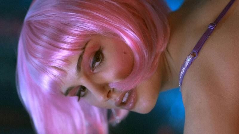 woman with pink hair in close-up