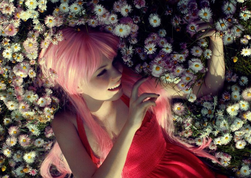 woman with pink hair in flowers
