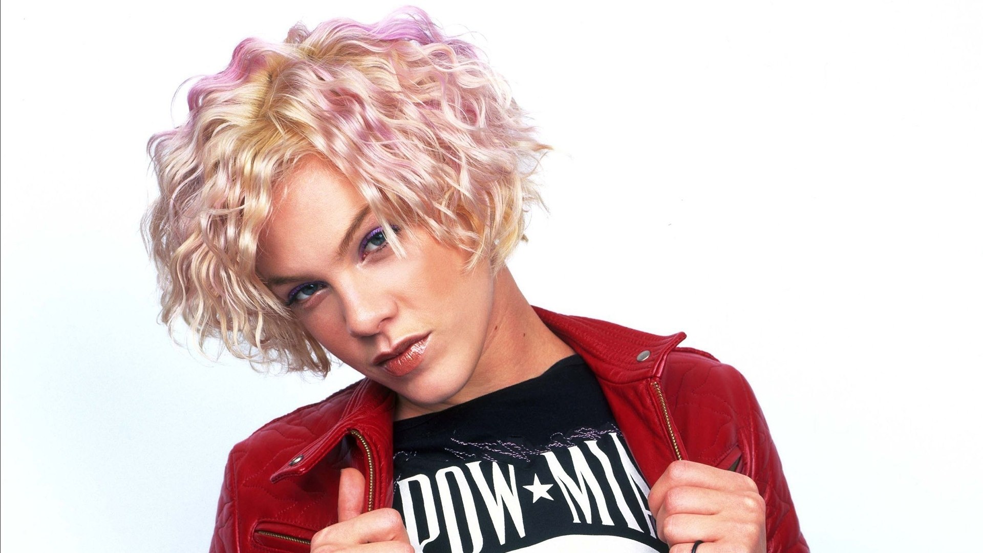 woman with pink hair in red jacket