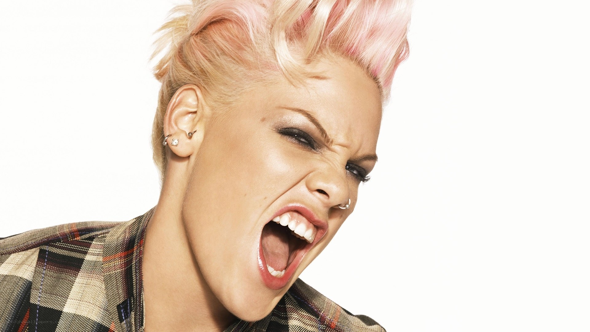 woman with pink hair shouting