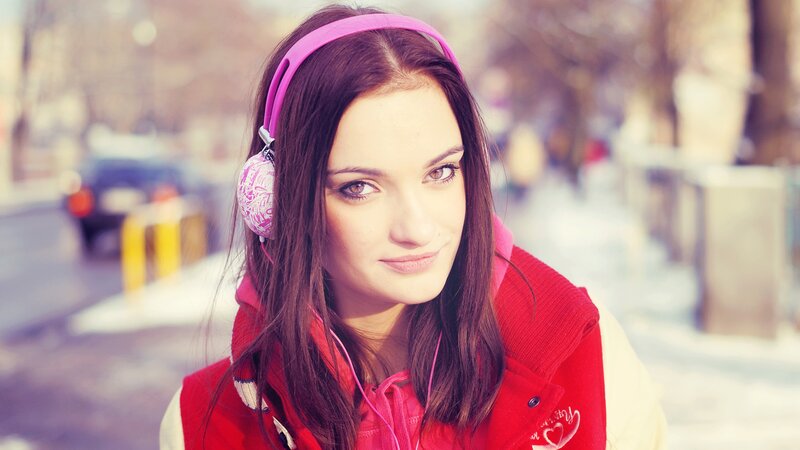 woman with pink headphones