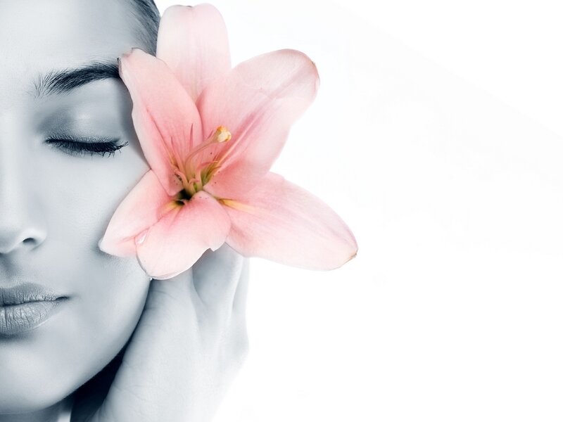 woman with pink lily flower