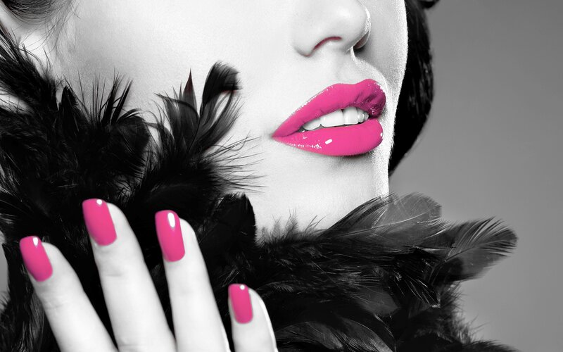 woman with pink lips and nails