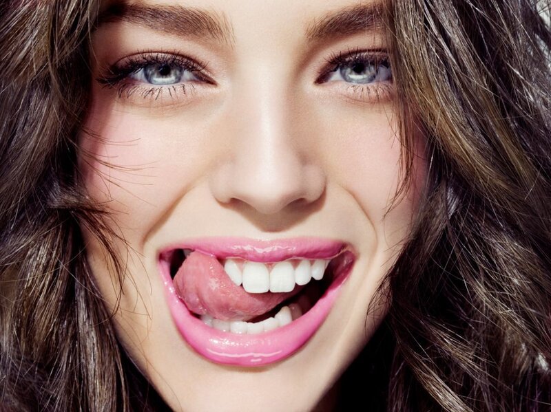 woman with pink lips smiling