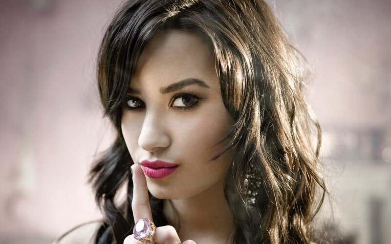 woman with pink lipstick and ring