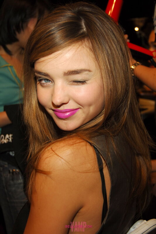 woman with pink lipstick smiling