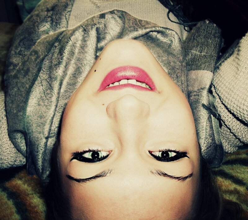 woman with pink lipstick smiling