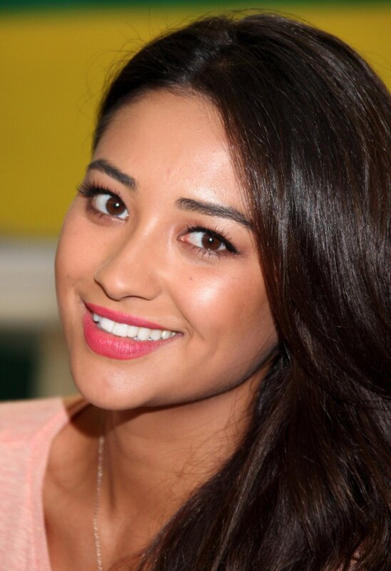 woman with pink lipstick smiling