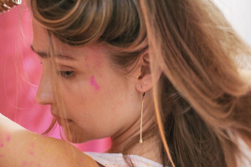 woman with pink paint on face