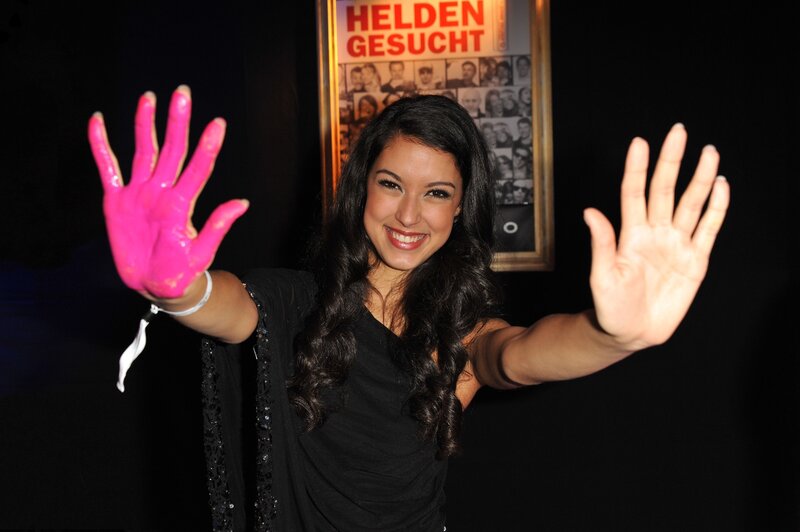 woman with pink-painted hand