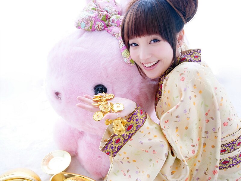 woman with pink plush toy