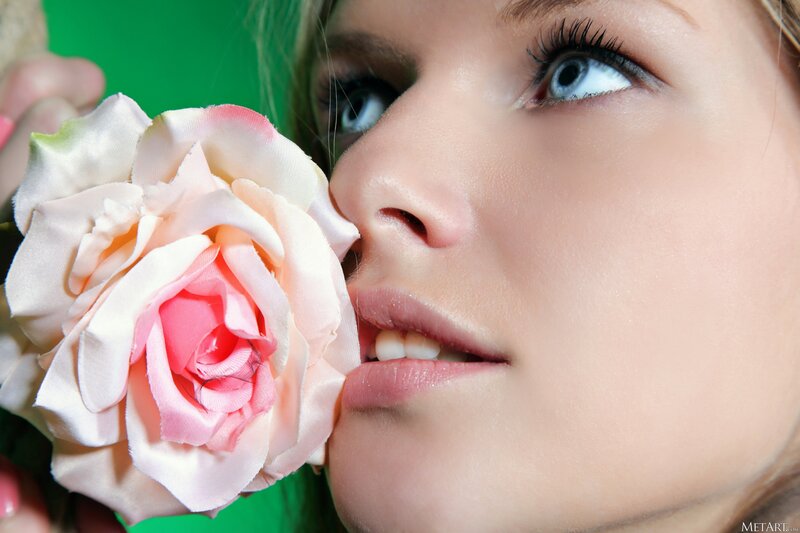 woman with pink rose