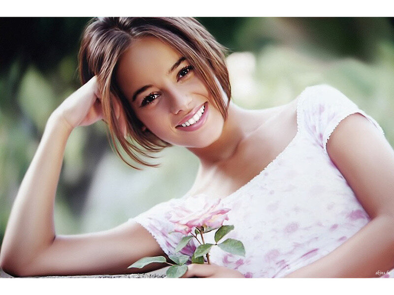 woman with pink rose