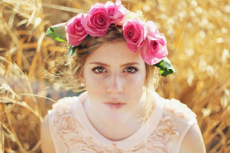 woman with pink rose crown