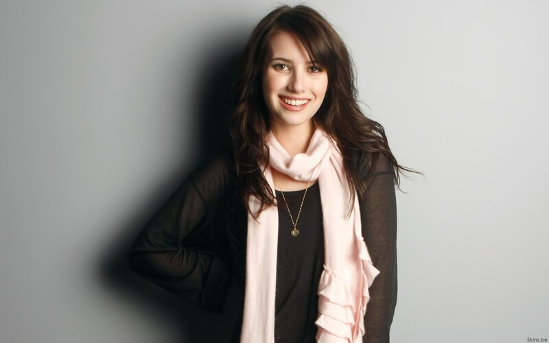woman with pink scarf smiling
