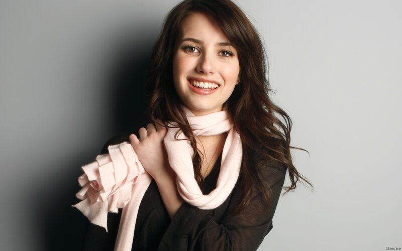 woman with pink scarf smiling