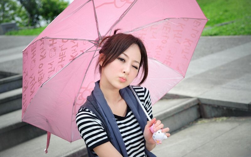 Woman with pink umbrella