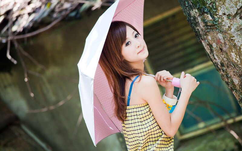 woman with pink umbrella