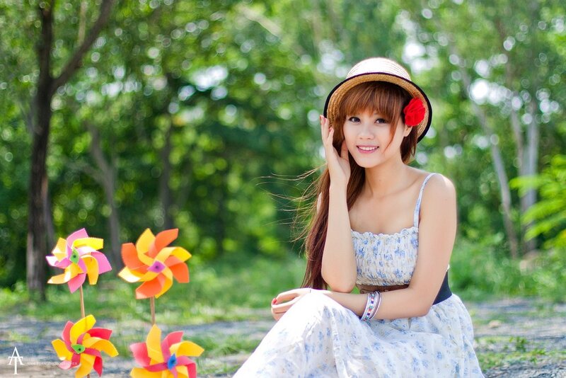 Woman with pinwheels in park