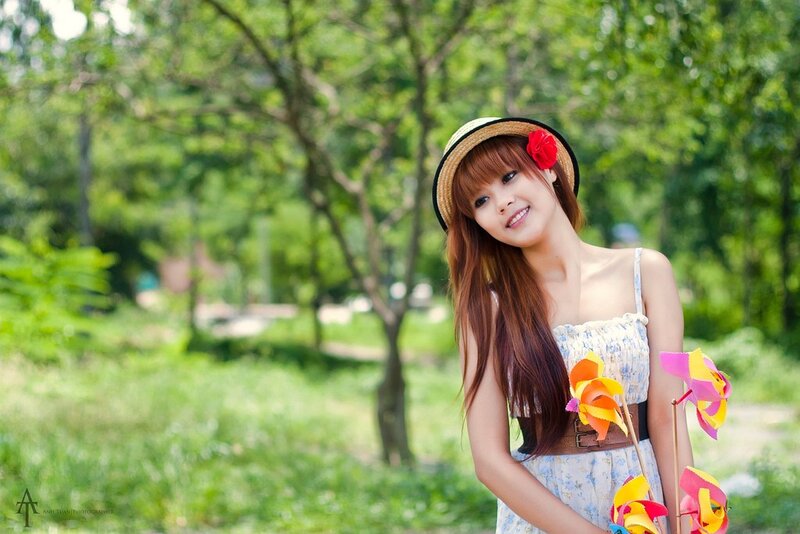 Woman with pinwheels in park