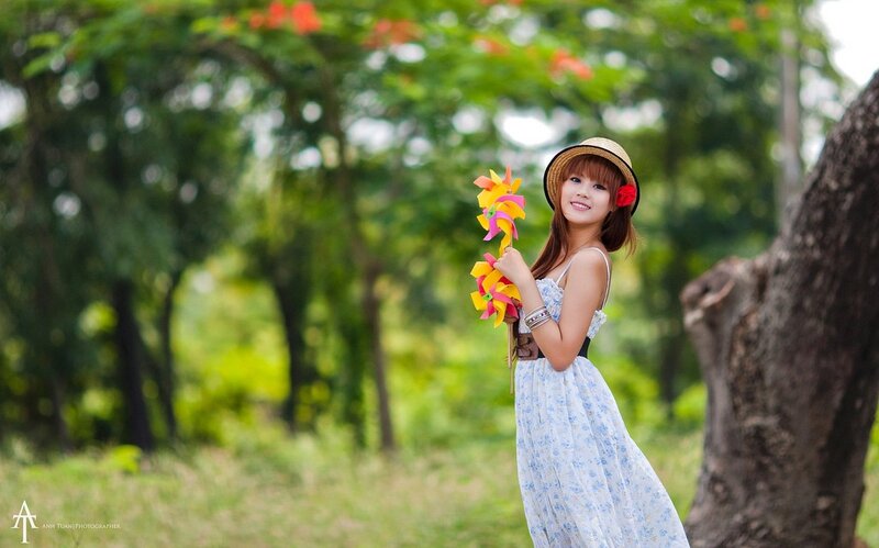 Woman with pinwheels in park