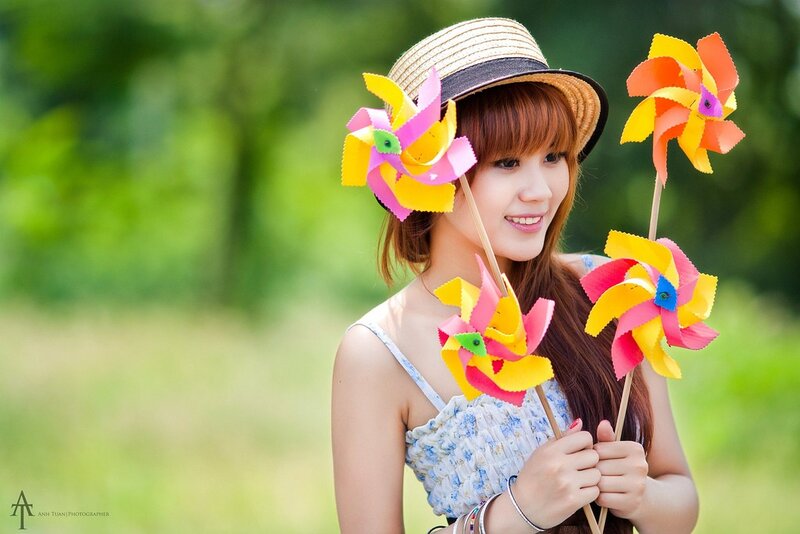 Woman with pinwheels in park