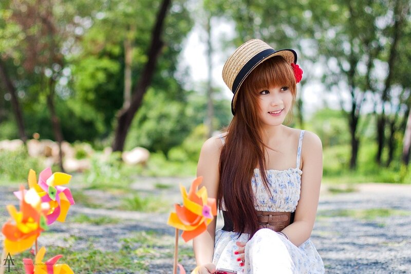 Woman with pinwheels in park