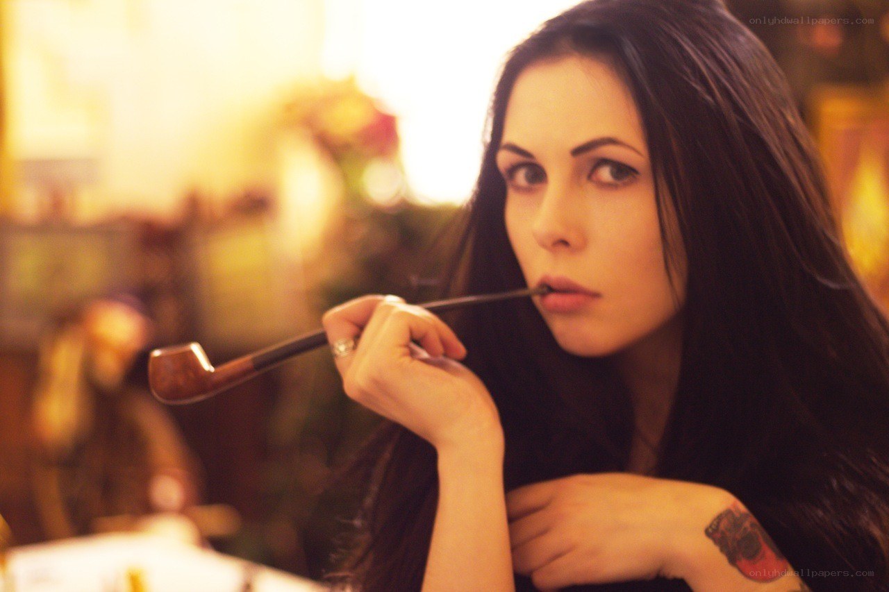 woman with pipe and tattoo