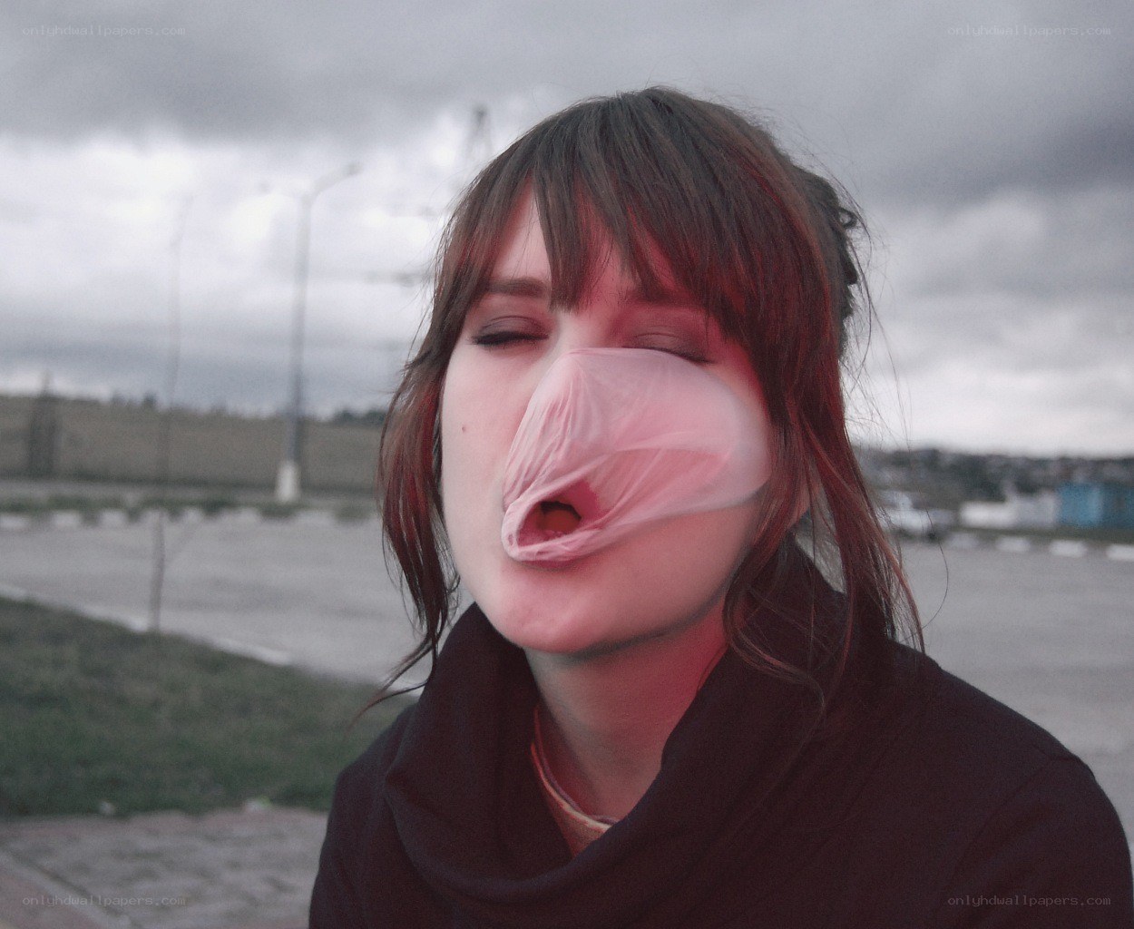 woman with plastic bag over face