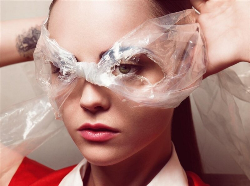 woman with plastic wrap over eyes