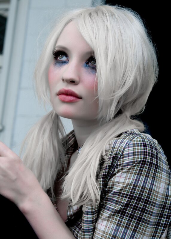 woman with platinum hair and dramatic makeup