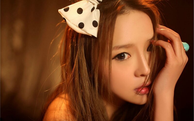 Woman with Polka-dot Bow — Brown