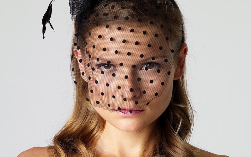 woman with polka dot veil