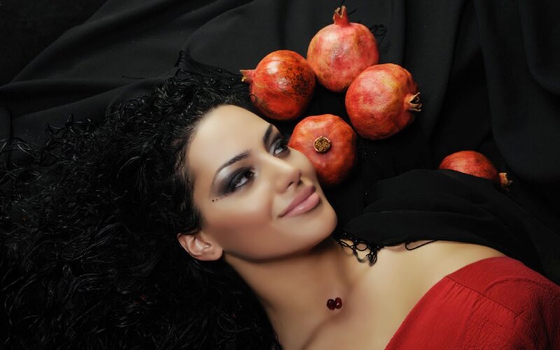 woman with pomegranates