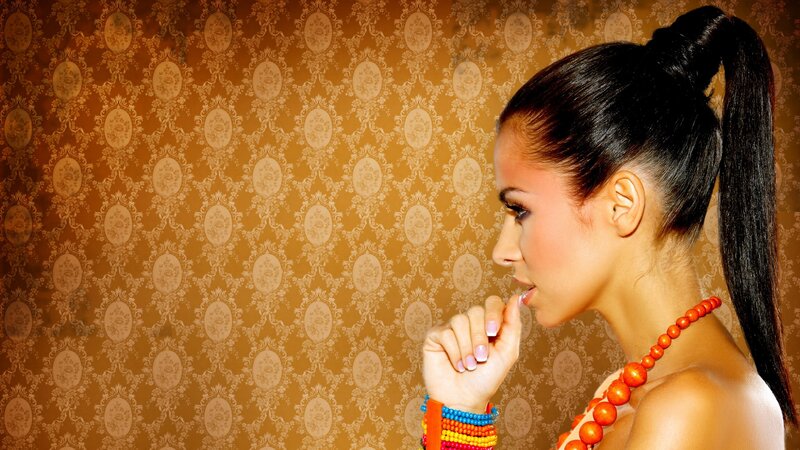 woman with ponytail and beads