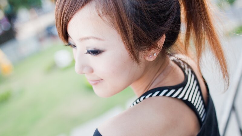 woman with ponytail looking down