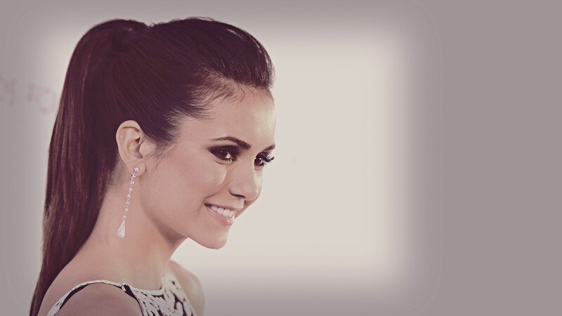 woman with ponytail smiling