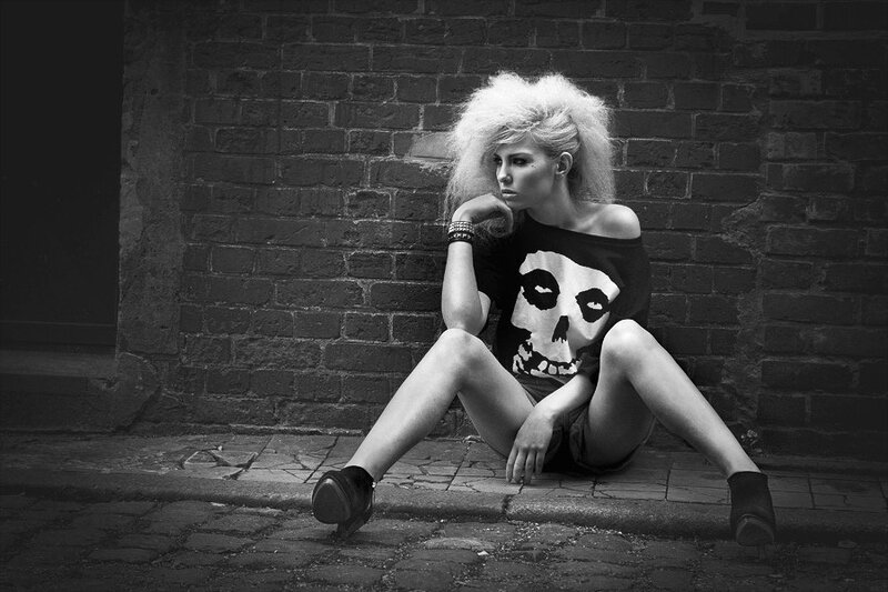 woman with punk style sitting
