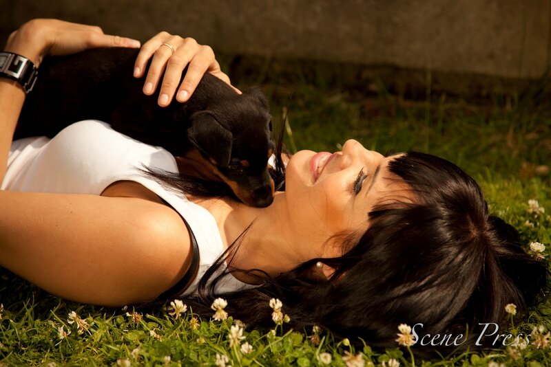 Woman with Puppy on Grass