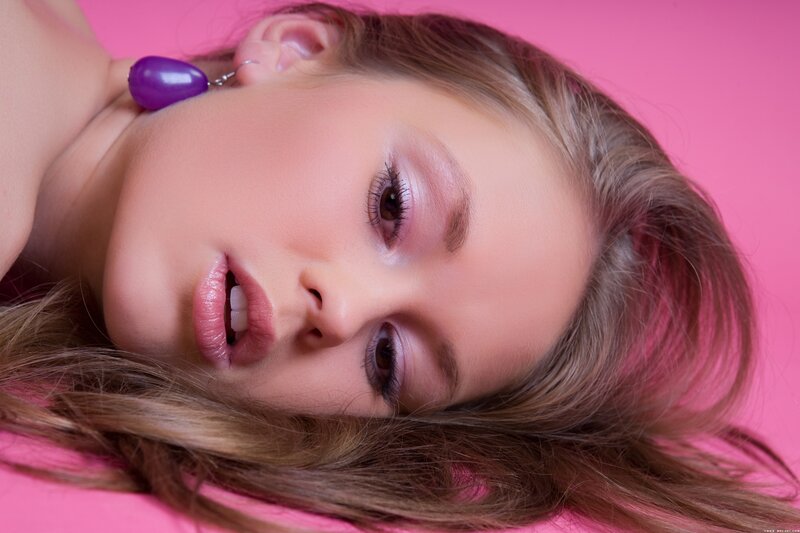 woman with purple earring
