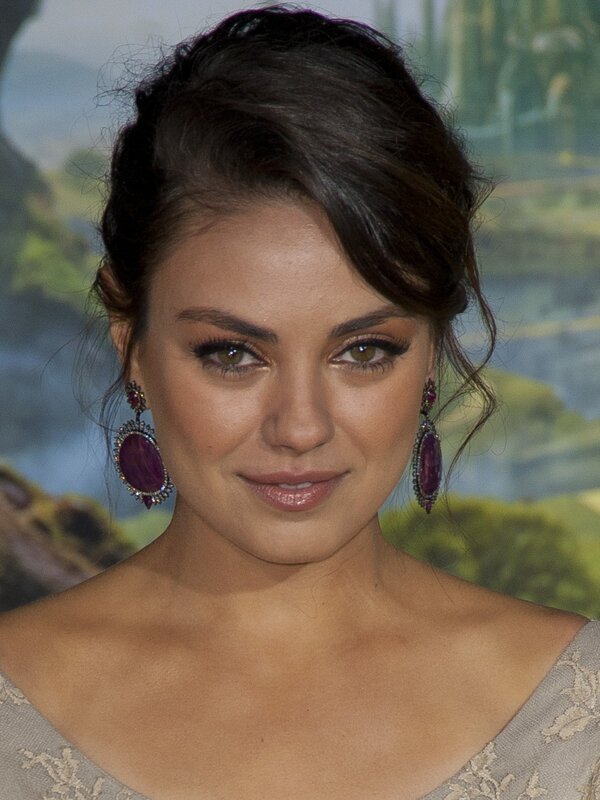 woman with purple earrings
