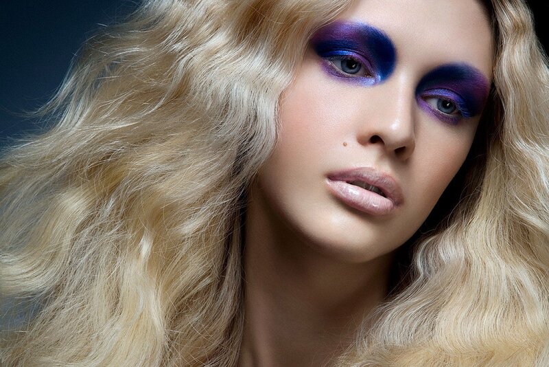 woman with purple eye makeup