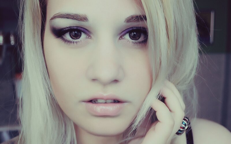 woman with purple eye makeup
