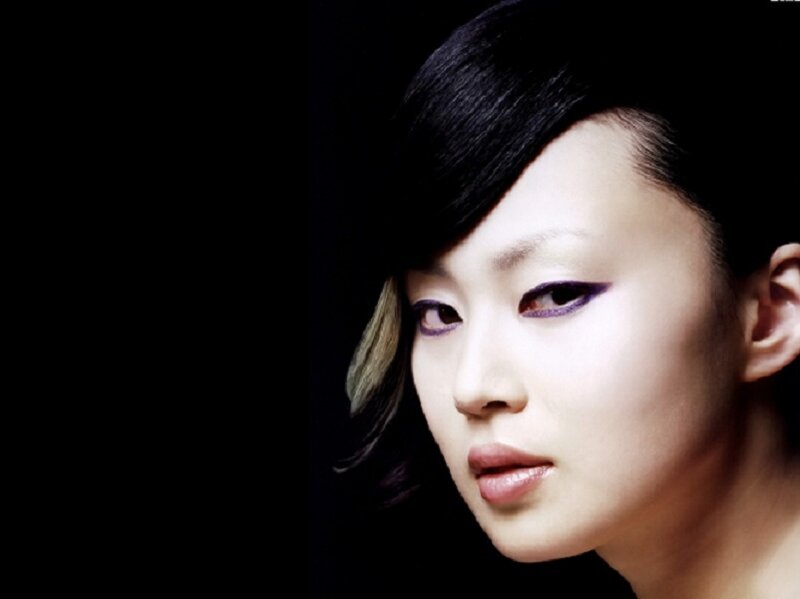 woman with purple eye makeup