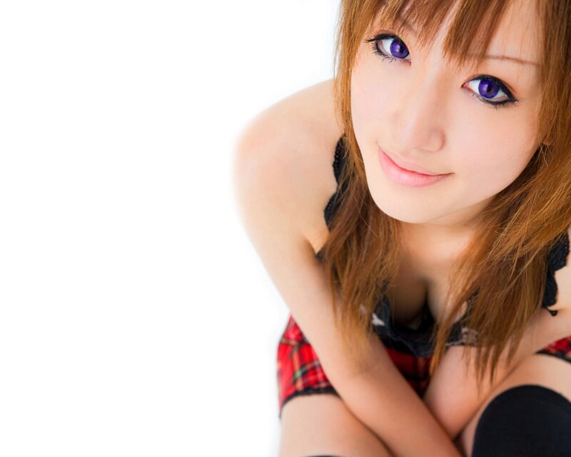 woman with purple eyes smiling